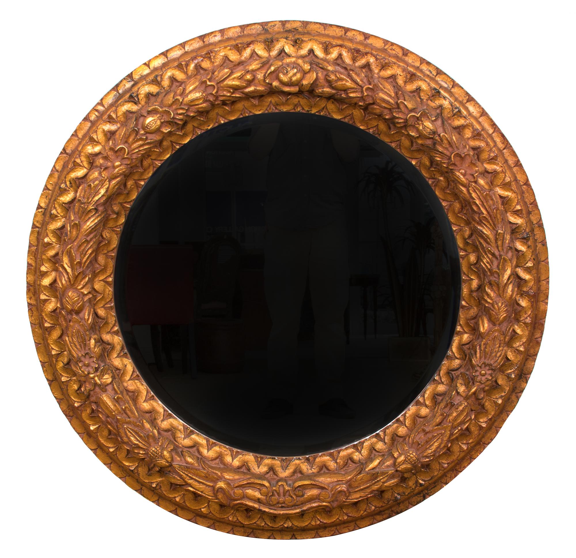 A Pair of Rococo Revival Carved Giltwood Mirrors Diameter 47 inches. — 20TH CENTURY