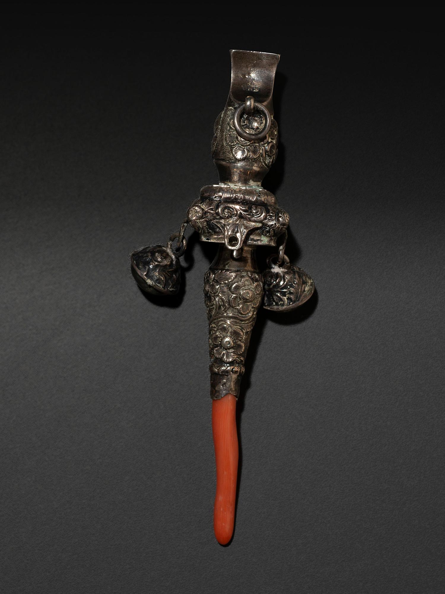 A Silver and Coral Mounted Child's Rattle Whistle