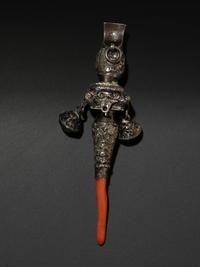 A Silver and Coral Mounted Child's Rattle Whistle