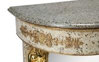 A Directoire Style Painted and Parcel-Gilt Granite-Top Console Table