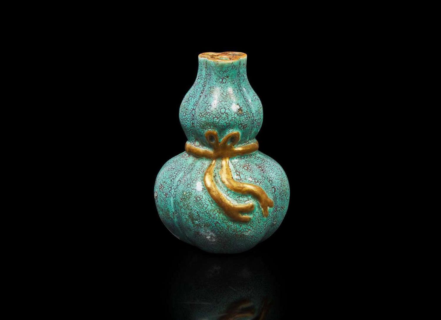 A small Chinese "Robin's-Egg"-glazed molded lobed double-gourd cabinet vase, Qing dynasty 爐鈞釉小葫蘆瓶 清
