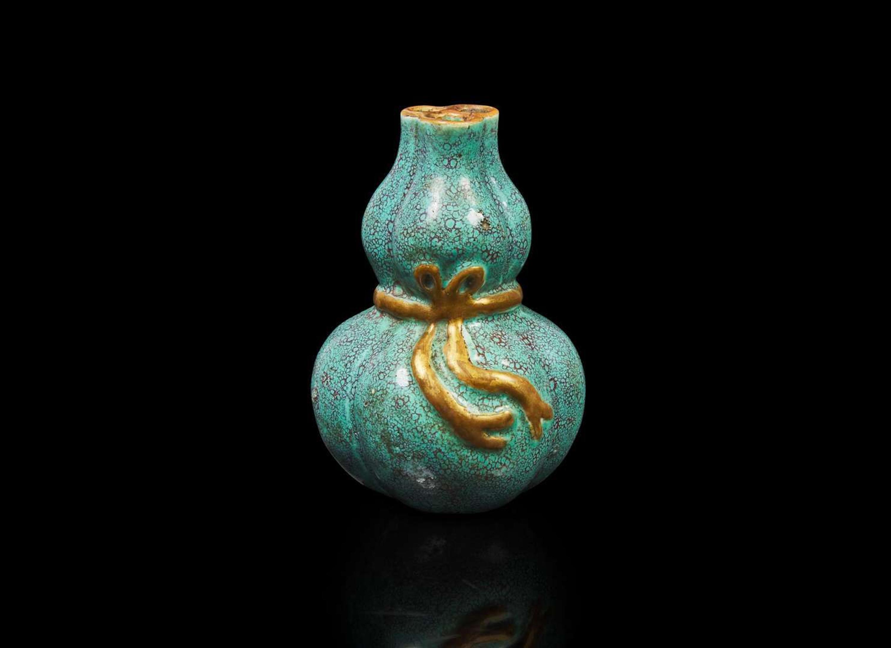 A small Chinese "Robin's-Egg"-glazed molded lobed double-gourd cabinet vase, Qing dynasty 爐鈞釉小葫蘆瓶 清