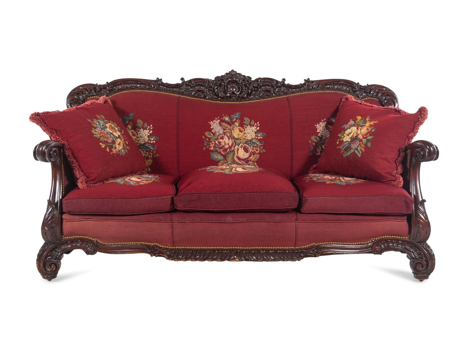 A Rococo Revival Carved Walnut Three-Piece Seating Suite in the Style of Karpen
