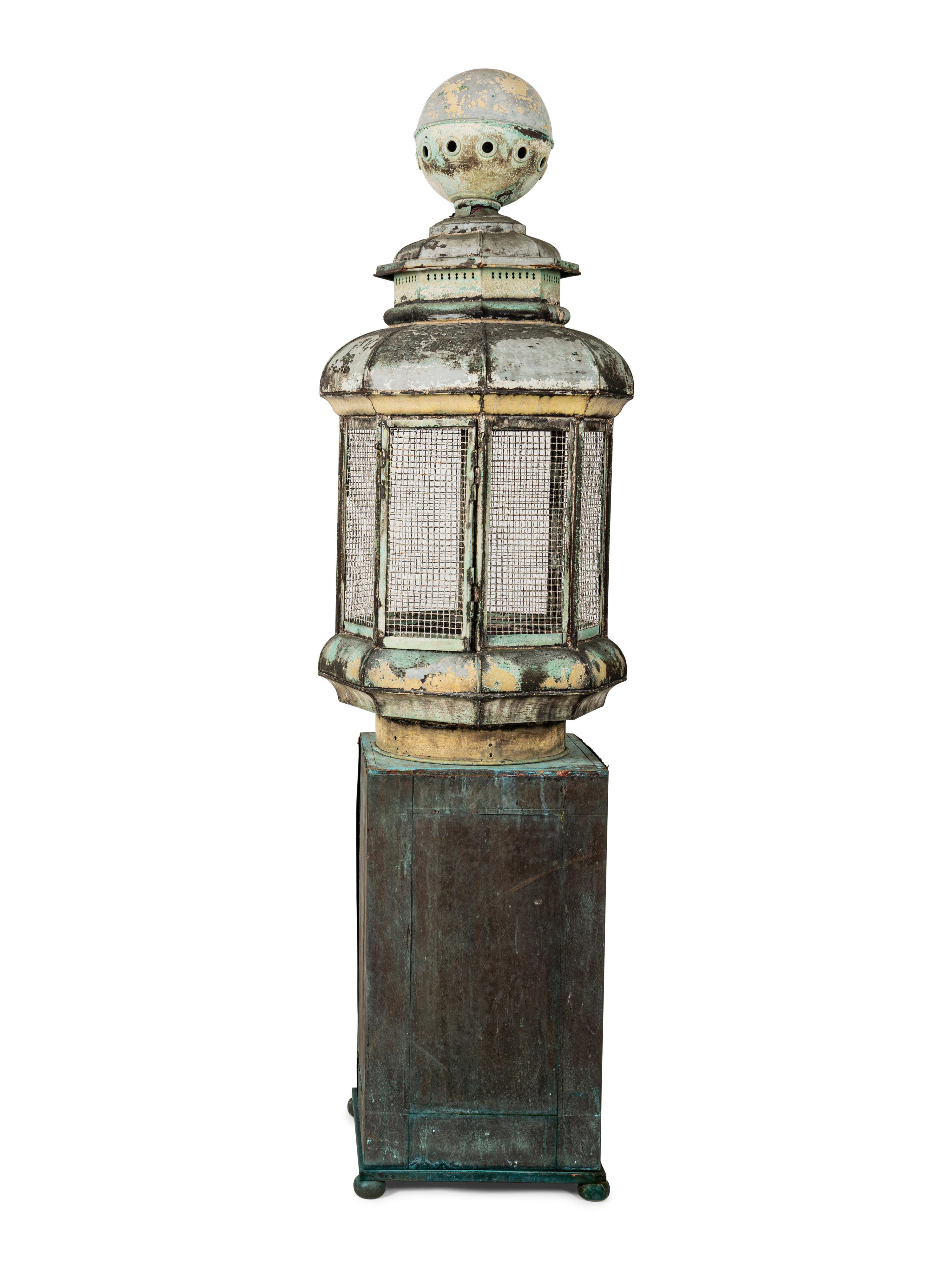 A Pair of Weathered Painted Sheet Metal Lanterns Converted to Bird Cages