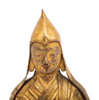 A Tibetan Gilt Bronze Repoussé Seated Figure of Tsongkhapa