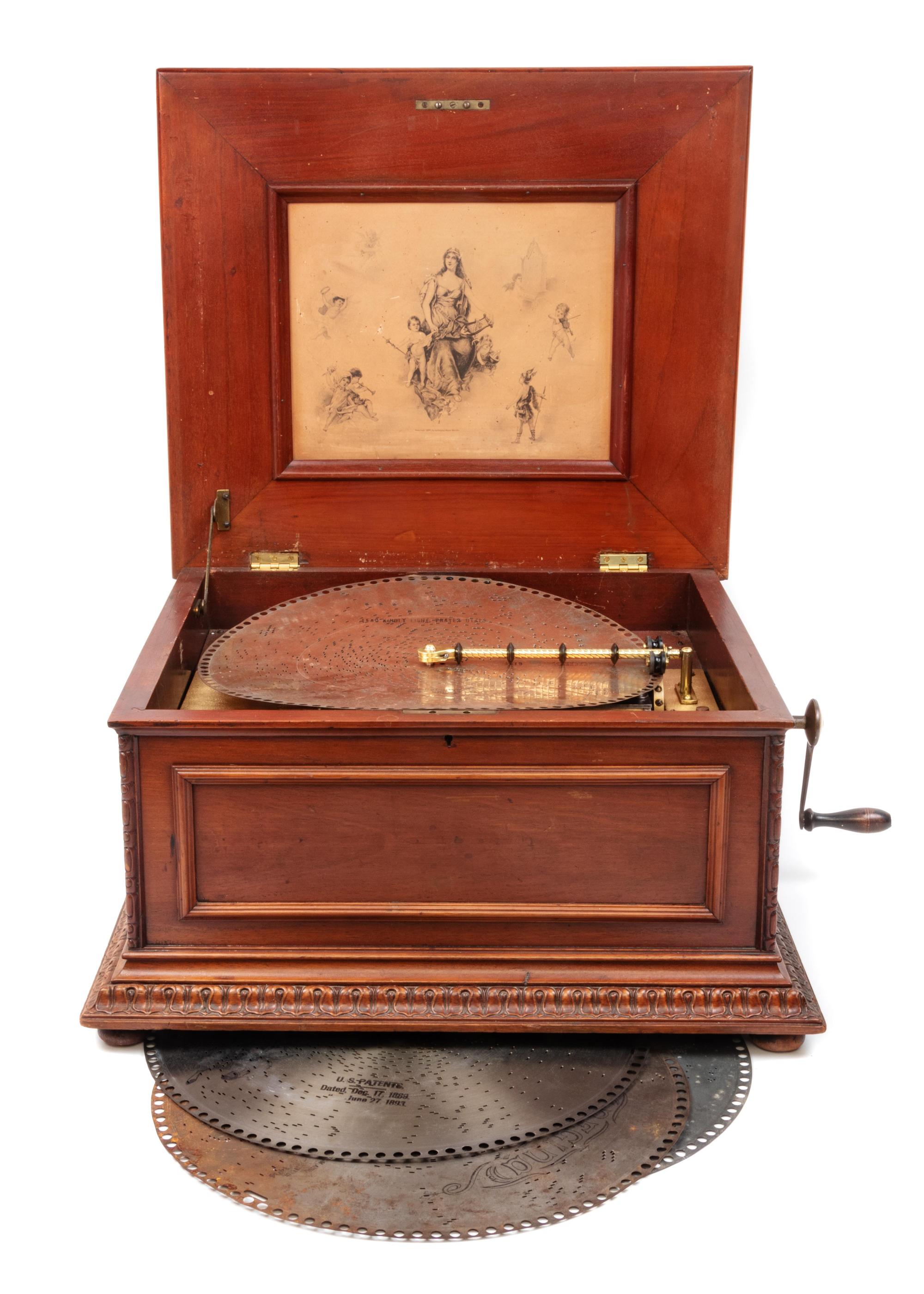 A Regina 15 1/2-Inch Double-Comb Disk Oak Music Box