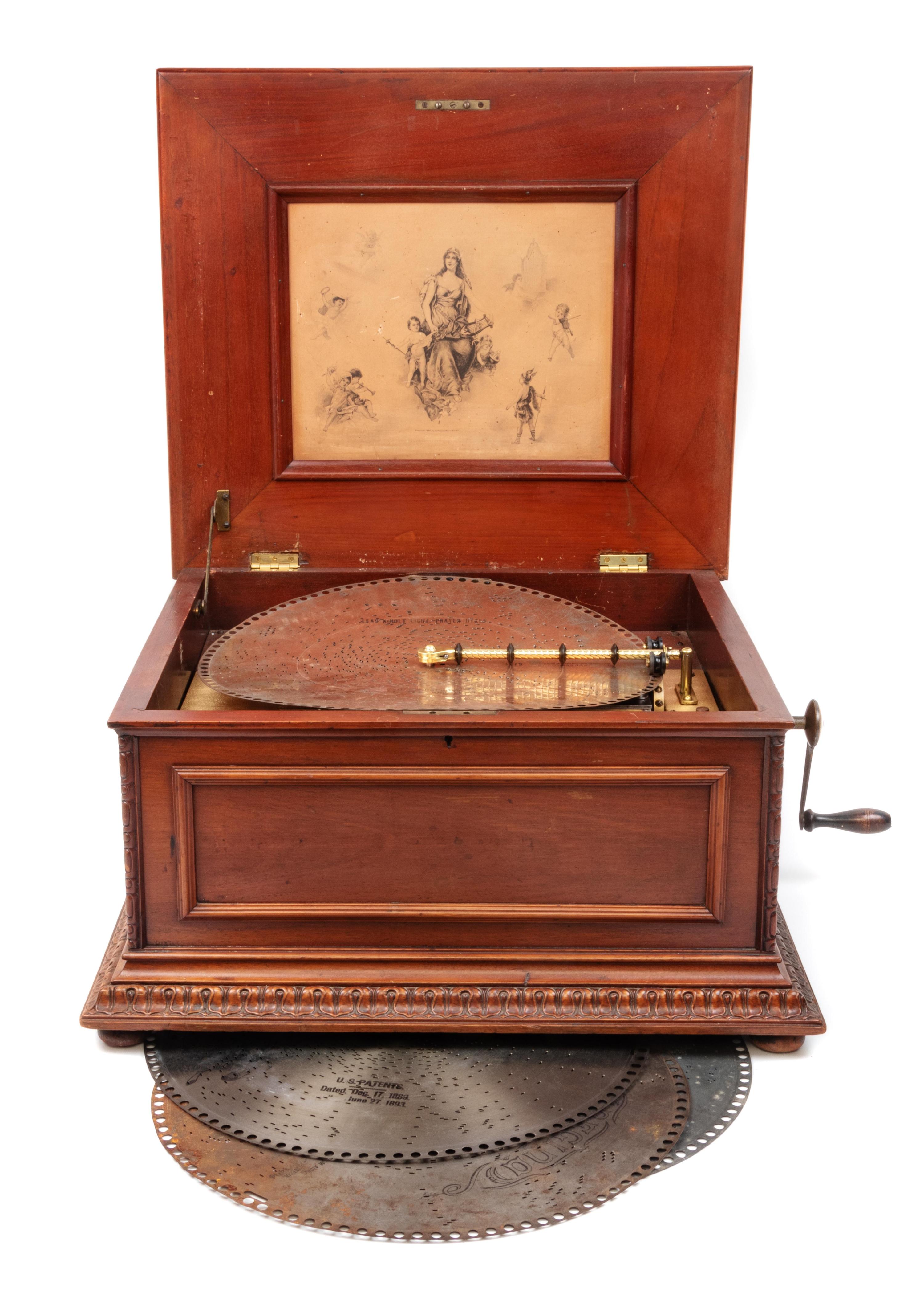 A Regina 15 1/2-Inch Double-Comb Disk Oak Music Box