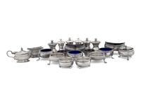 A Collection of Silver Pepper Mills and Salt Cellars
