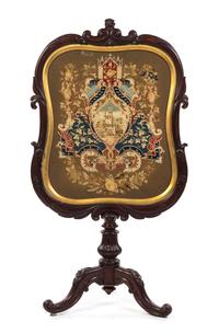 A Victorian Mahogany Firescreen, Height 49 3/4 inches.