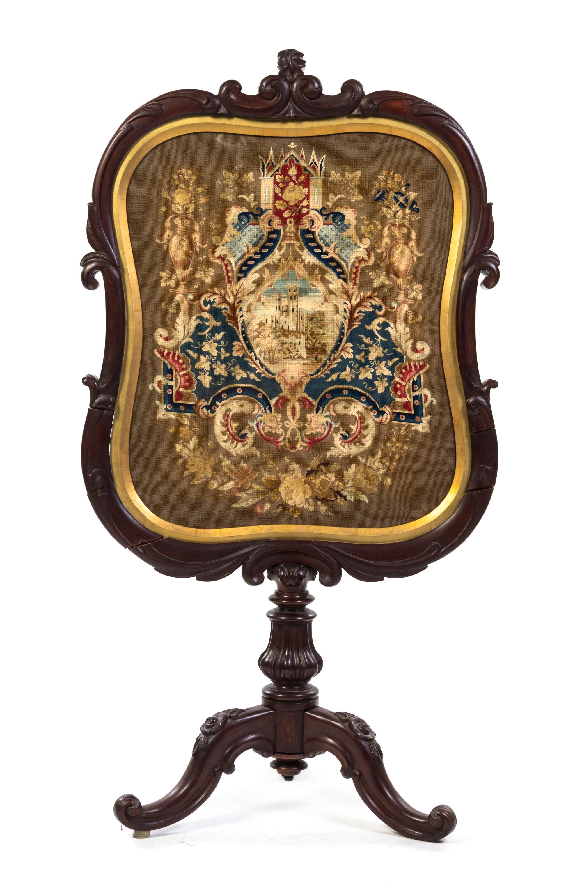 A Victorian Mahogany Firescreen, Height 49 3/4 inches.