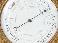 A Louis XVI Style Gilt Bronze Cartel Clock and Matching Barometer