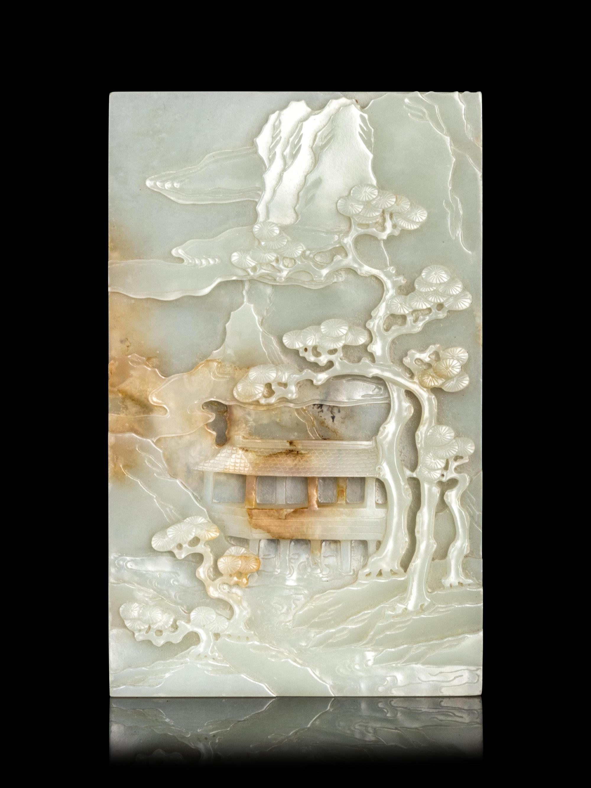 A Carved White and Russet Jade 'Mountainscape' Plaque