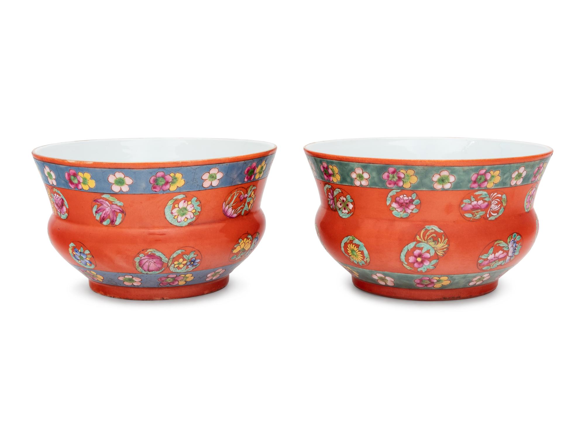 A Pair of Chinese Coral Red Ground Porcelain Cache Pots with Wood Stands