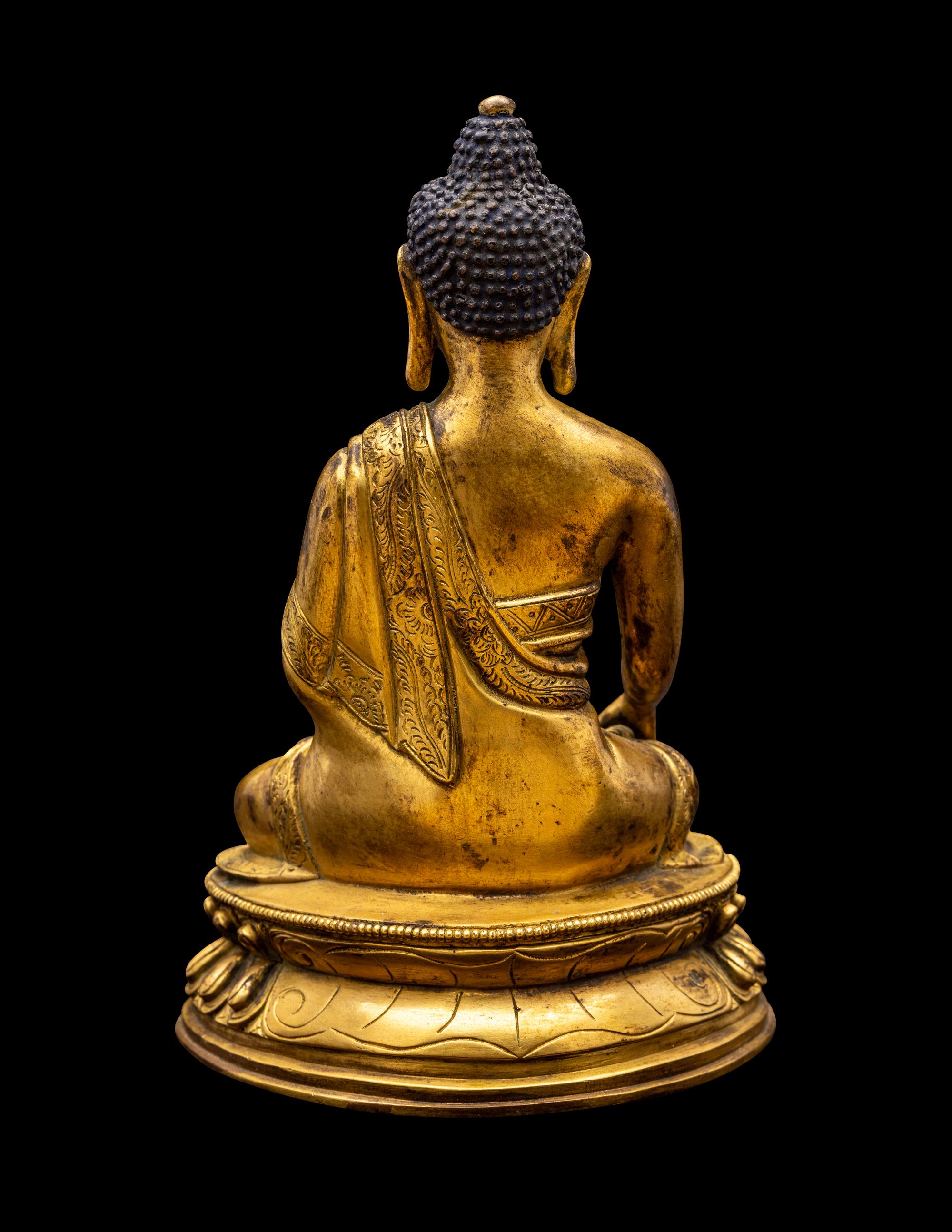 A Sino-Tibetan Gilt Bronze Figure of Seated Buddha
