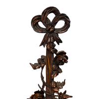 A Louis XVI Style Carved Walnut Mirror