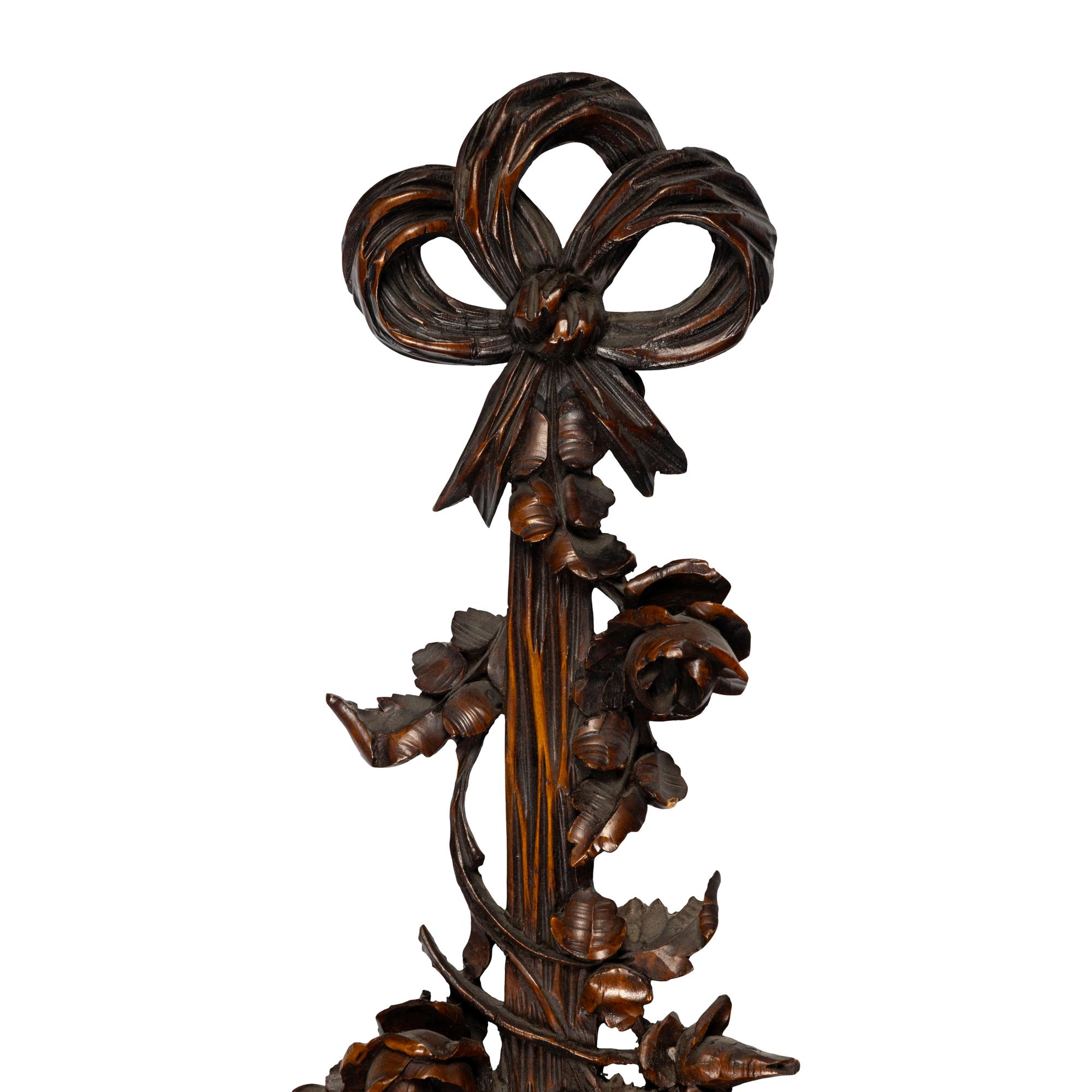 A Louis XVI Style Carved Walnut Mirror