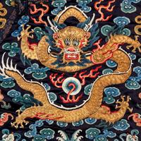 A Chinese Black Ground Embroidered Silk 'Dragon' Court Robe, Chaofugua, 19th Century 清晚期 黑緞地綉云龍紋朝服褂