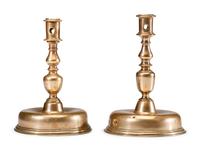A Near Pair of Dutch William and Mary Brass Bell-Bottom Candlesticks