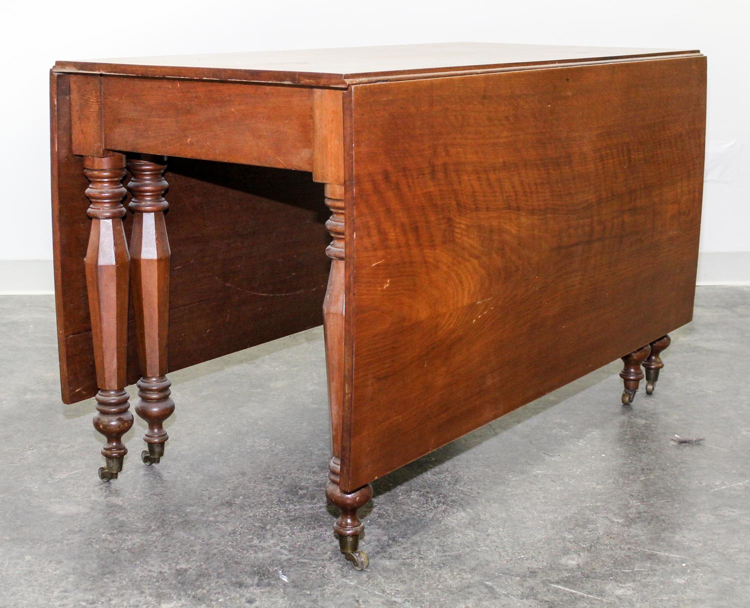 An American Empire Cherry Drop Leaf Table Height 29 x length 54 inches. — 19TH CENTURY