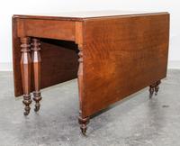 An American Empire Cherry Drop Leaf Table Height 29 x length 54 inches. — 19TH CENTURY