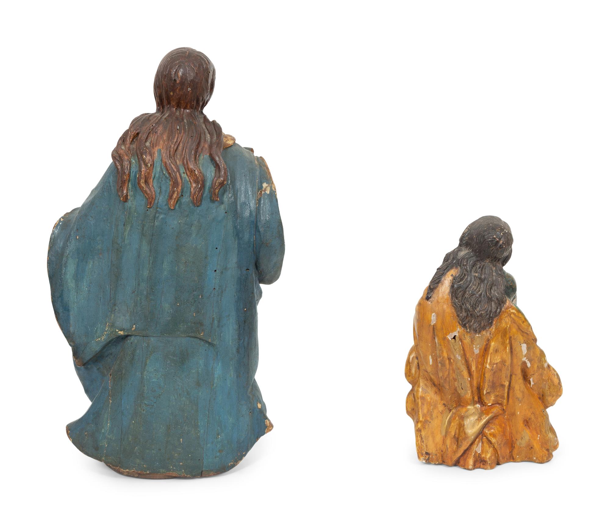 Two Italian Polychromed and Gilt Santos Figures
