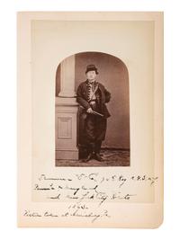 [CIVIL WAR]. Cabinet card of a Union Drummer in uniform with period notation, "Drummer 'D' Co., 74th Reg. N.G.N.Y." Harrisburg, PA: 1863.