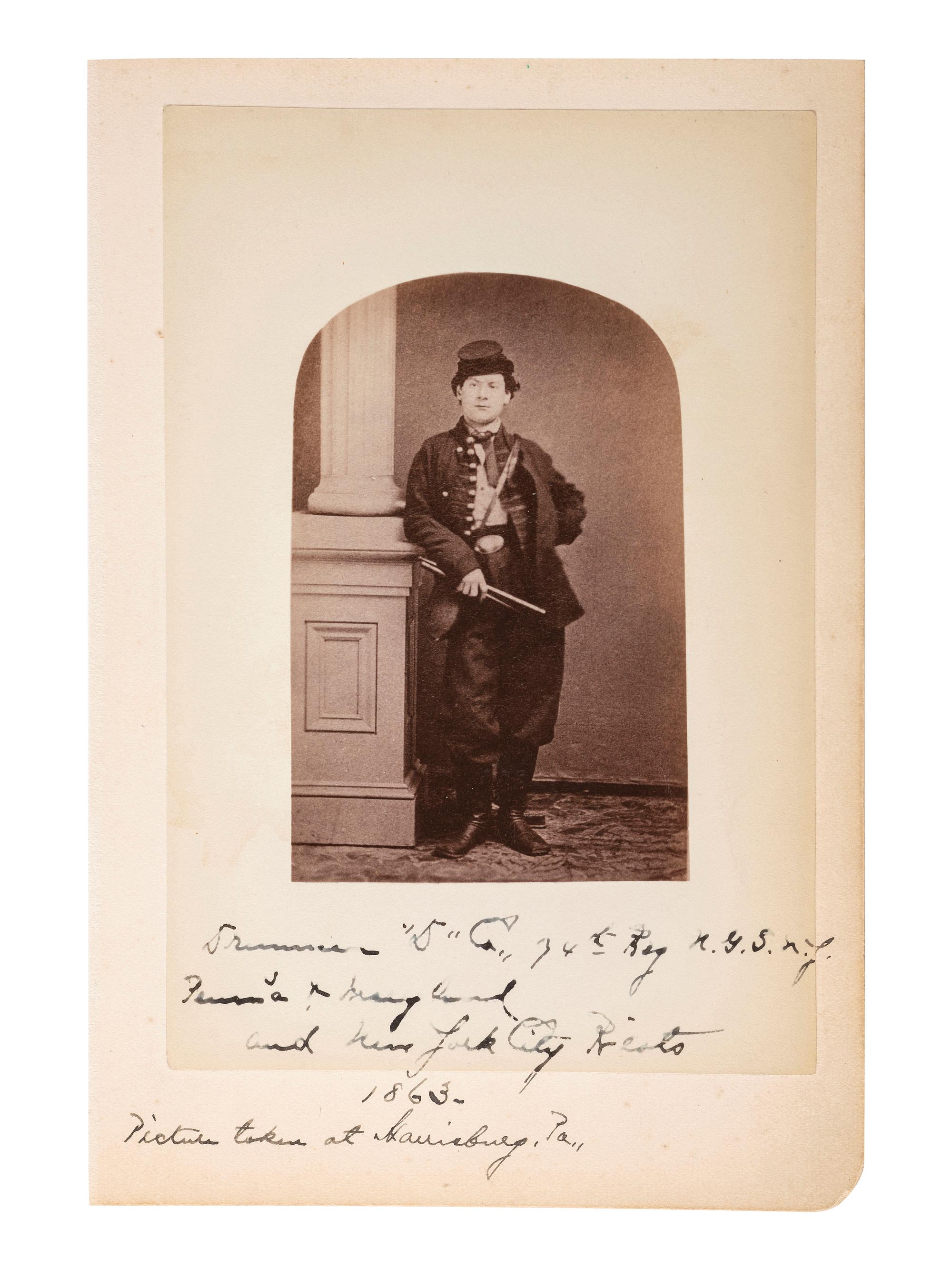 [CIVIL WAR]. Cabinet card of a Union Drummer in uniform with period notation, "Drummer 'D' Co., 74th Reg. N.G.N.Y." Harrisburg, PA: 1863.