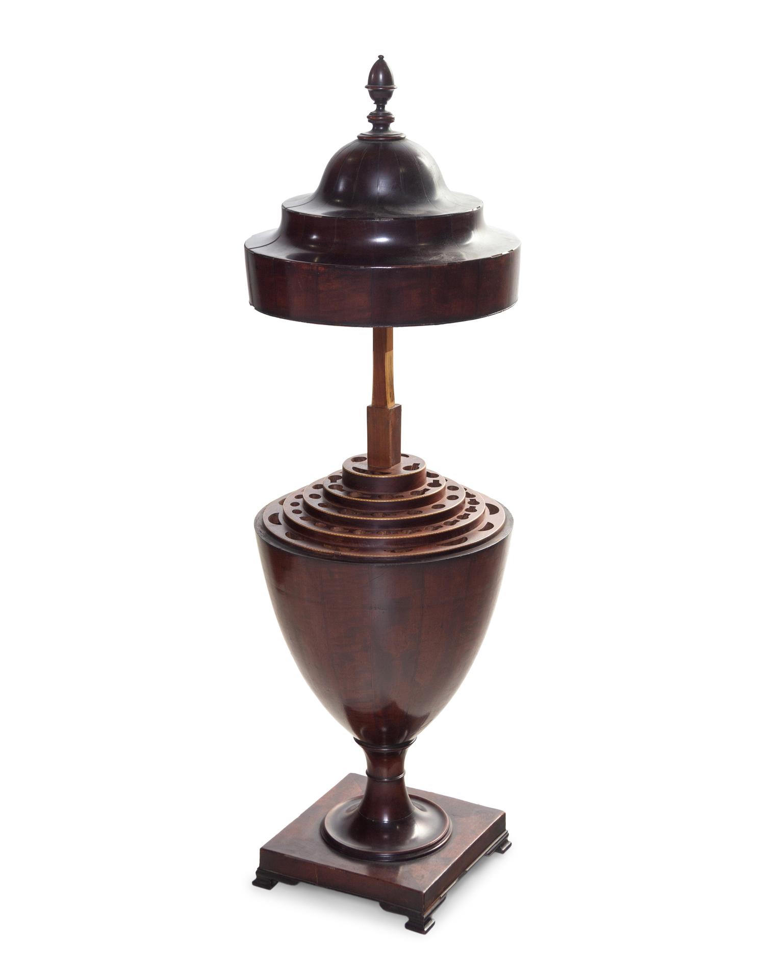 An Edwardian Carved and Figured Mahogany Double Pedestal Sideboard and a Pair of Urn-Form Cutlery Boxes
