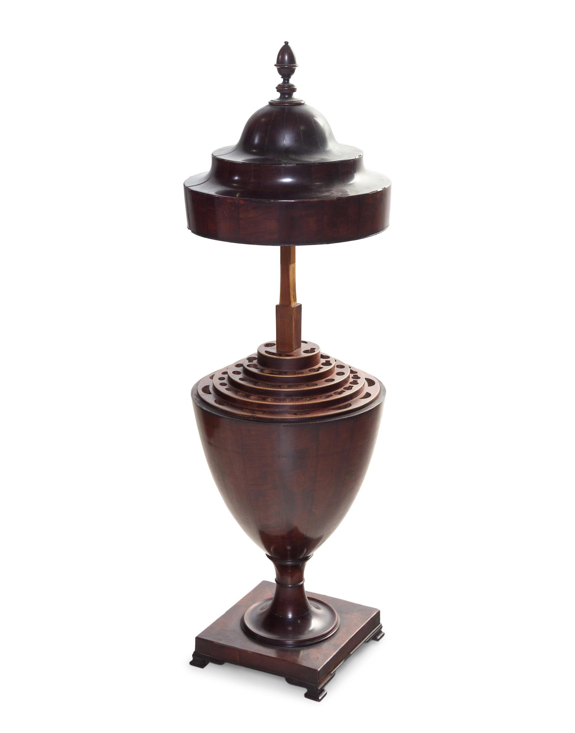 An Edwardian Carved and Figured Mahogany Double Pedestal Sideboard and a Pair of Urn-Form Cutlery Boxes