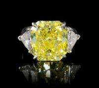 A Fine Platinum, Fancy Intense Yellow Diamond and Diamond Ring, 7.40 dwts.