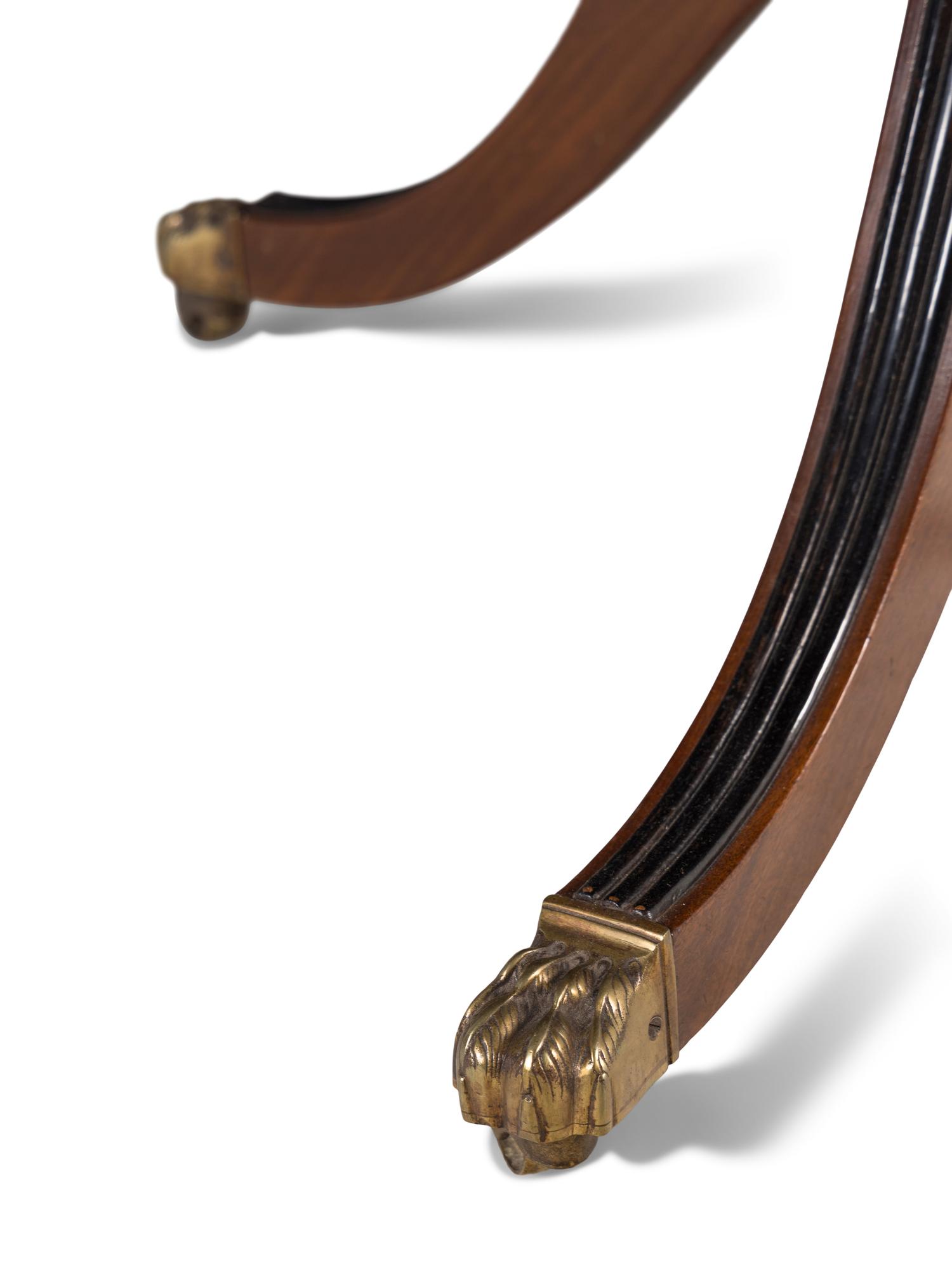 A George III Mahogany and Parcel Ebonized Drum Table