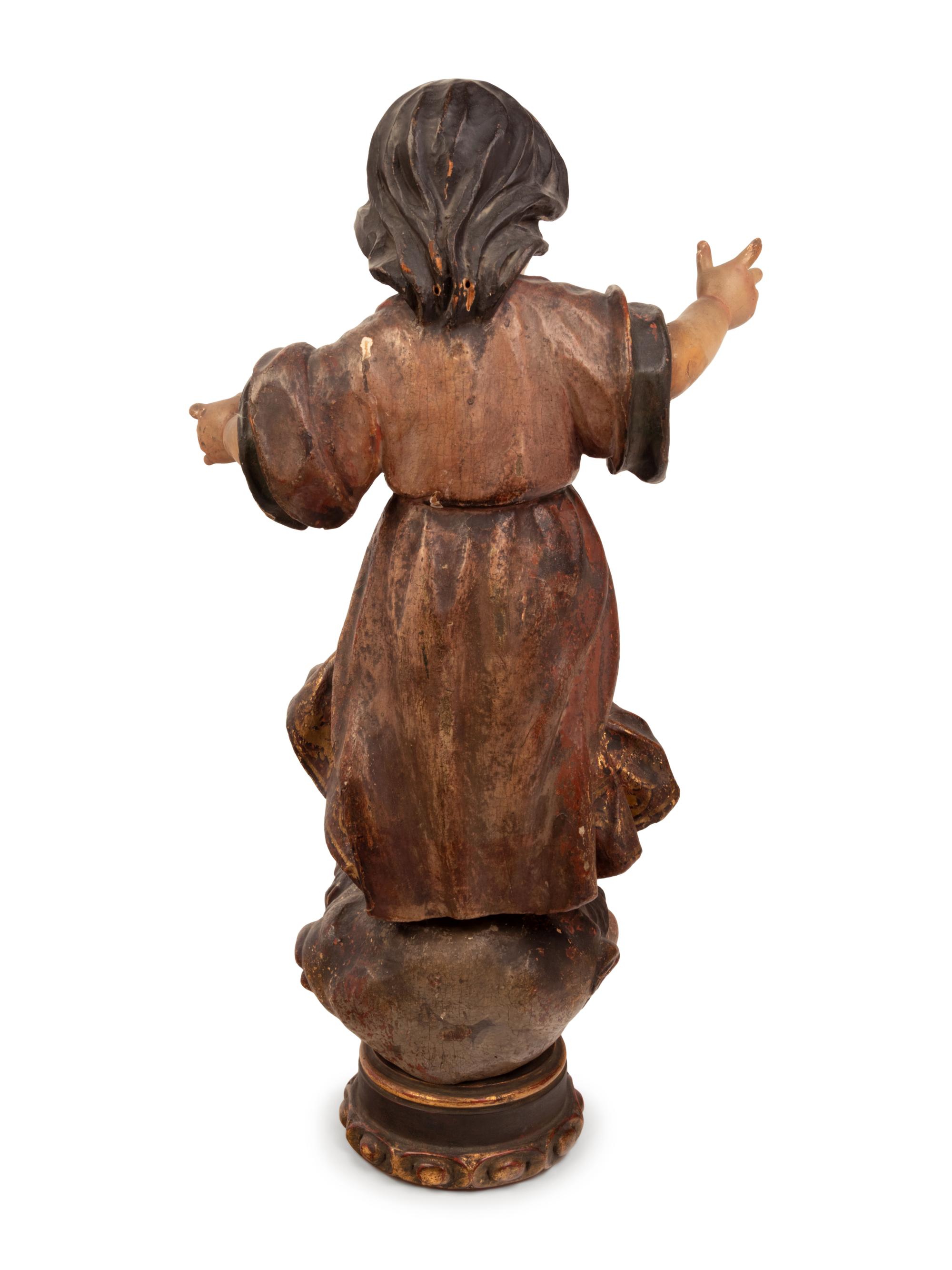 A Continental Parcel Gilt and Polychrome Decorated Putto
