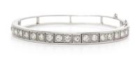 A 14 Karat White Gold and Diamond Bangle Bracelet, 12.50 dwts.