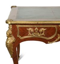 A Louis XV Style Gilt Bronze Mounted Kingwood Bureau Plat