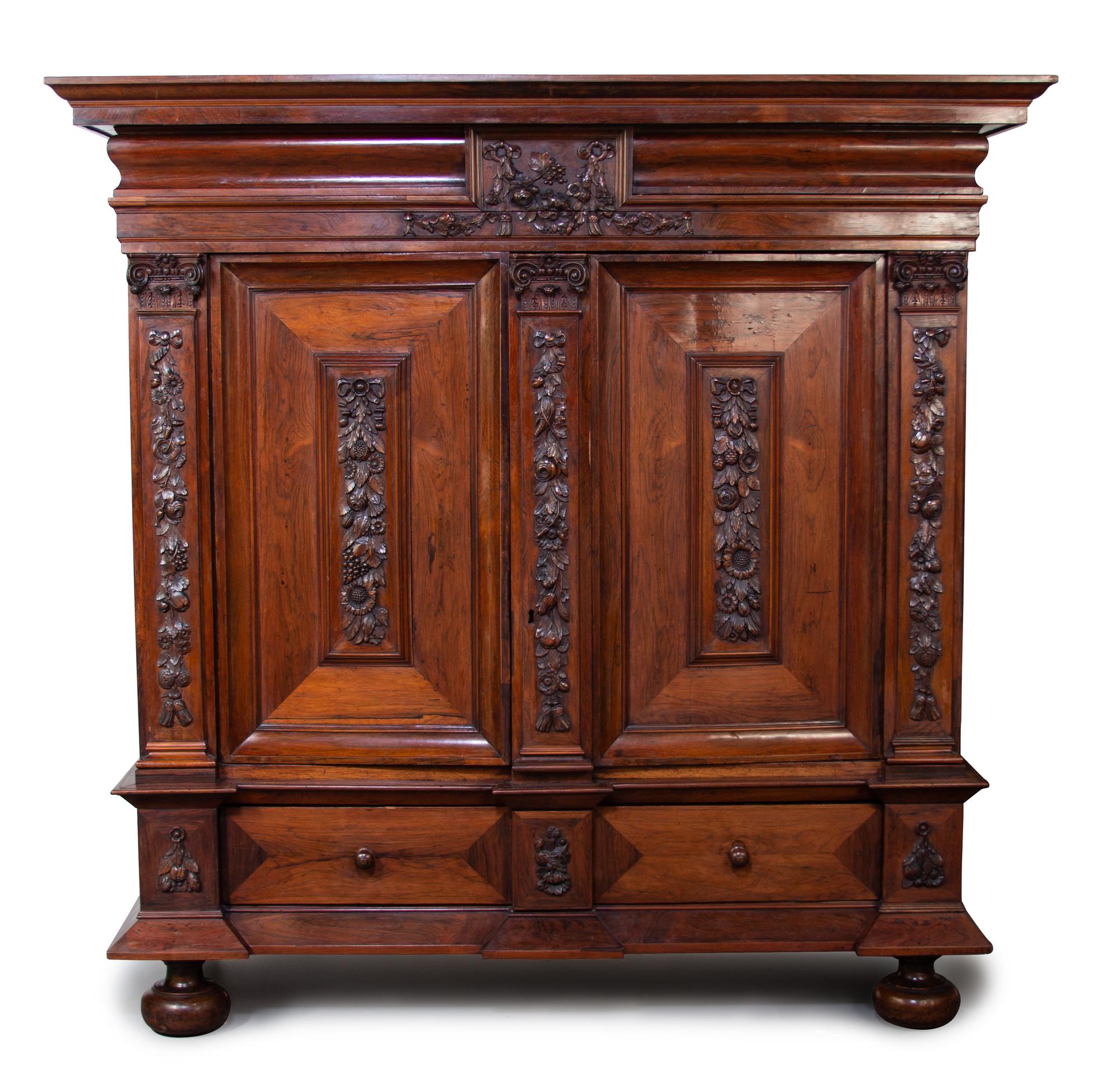 A Portuguese Carved Rosewood Linen Press Height 83 1/2 x width 84 x depth 29 inches. — 19TH CENTURY