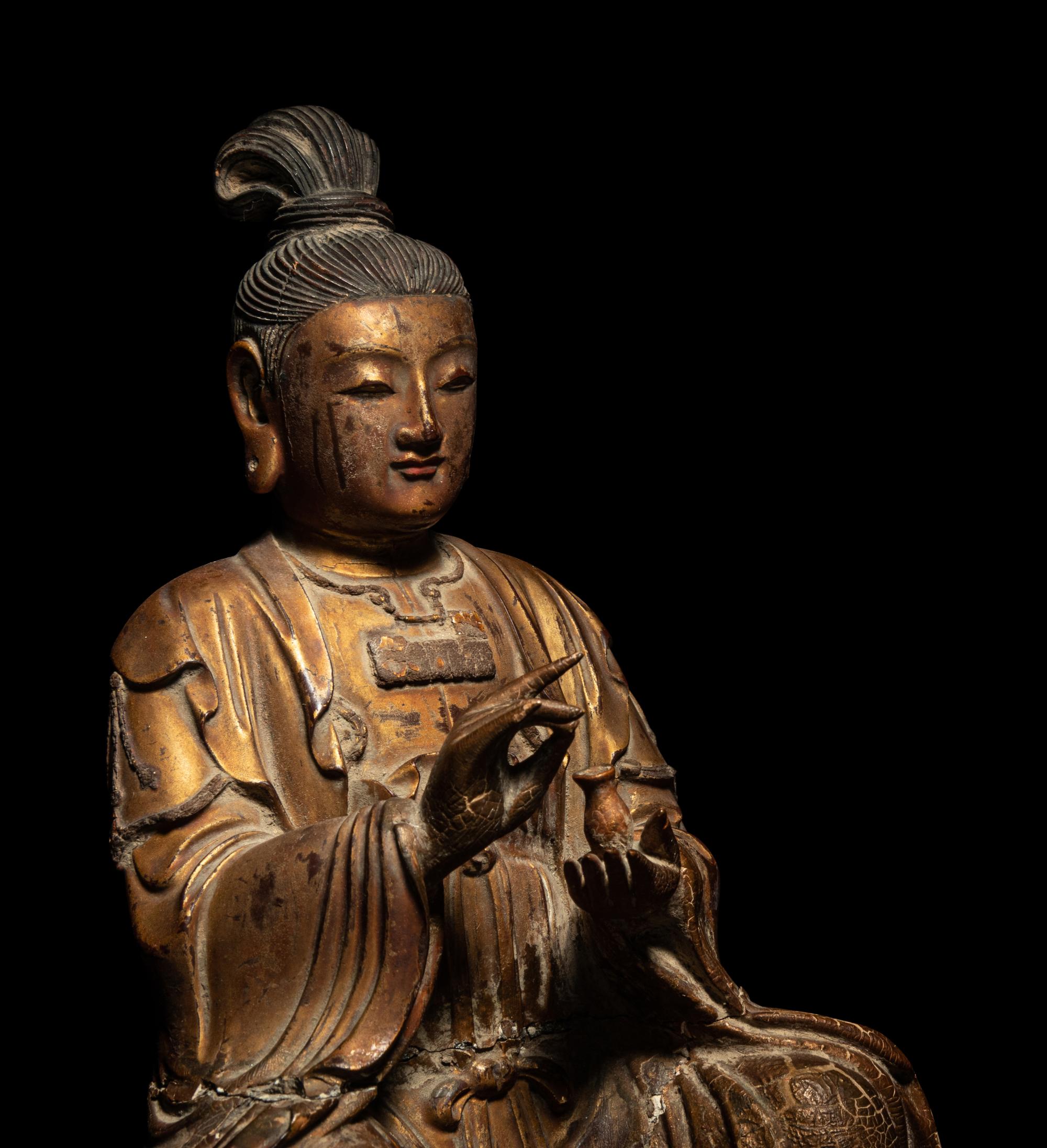A Gilt Wood Figure of Seated Guanyin