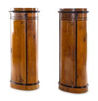 A Pair of Biedermeier Style Parcel Ebonized Satinwood Pedestal-Form Cabinets