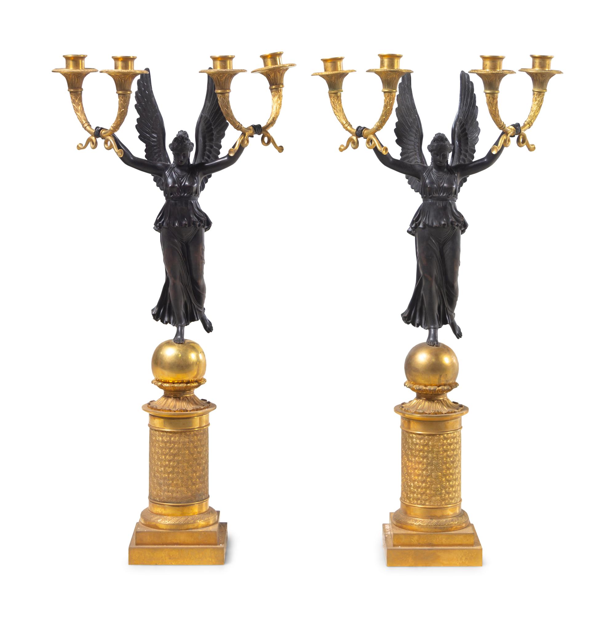 A Pair of Empire Style Gilt and Patinated Bronze Four-Light Candelabra