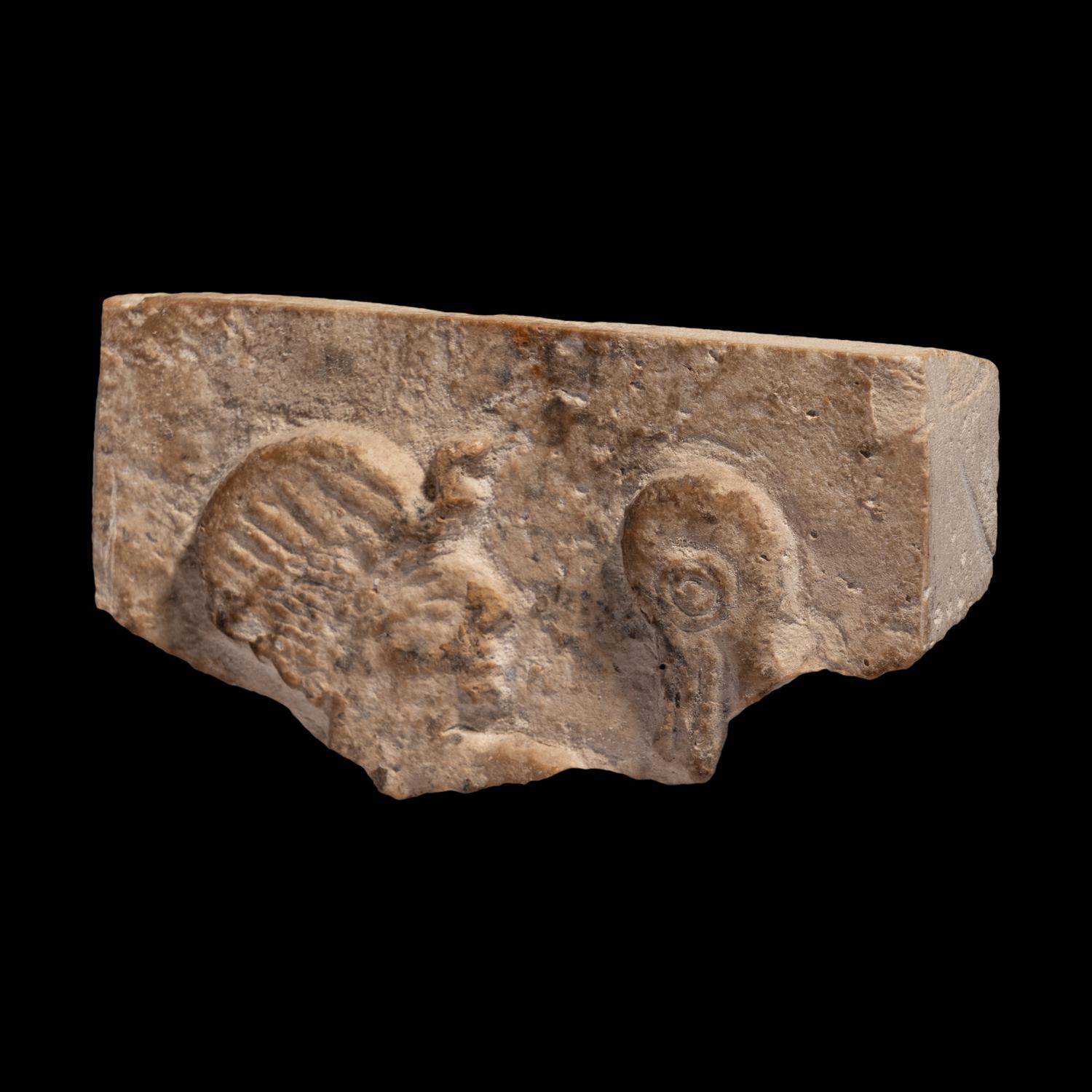 An Egyptian Limestone Relief Fragment with the Head of a Pharaoh