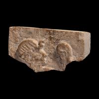An Egyptian Limestone Relief Fragment with the Head of a Pharaoh