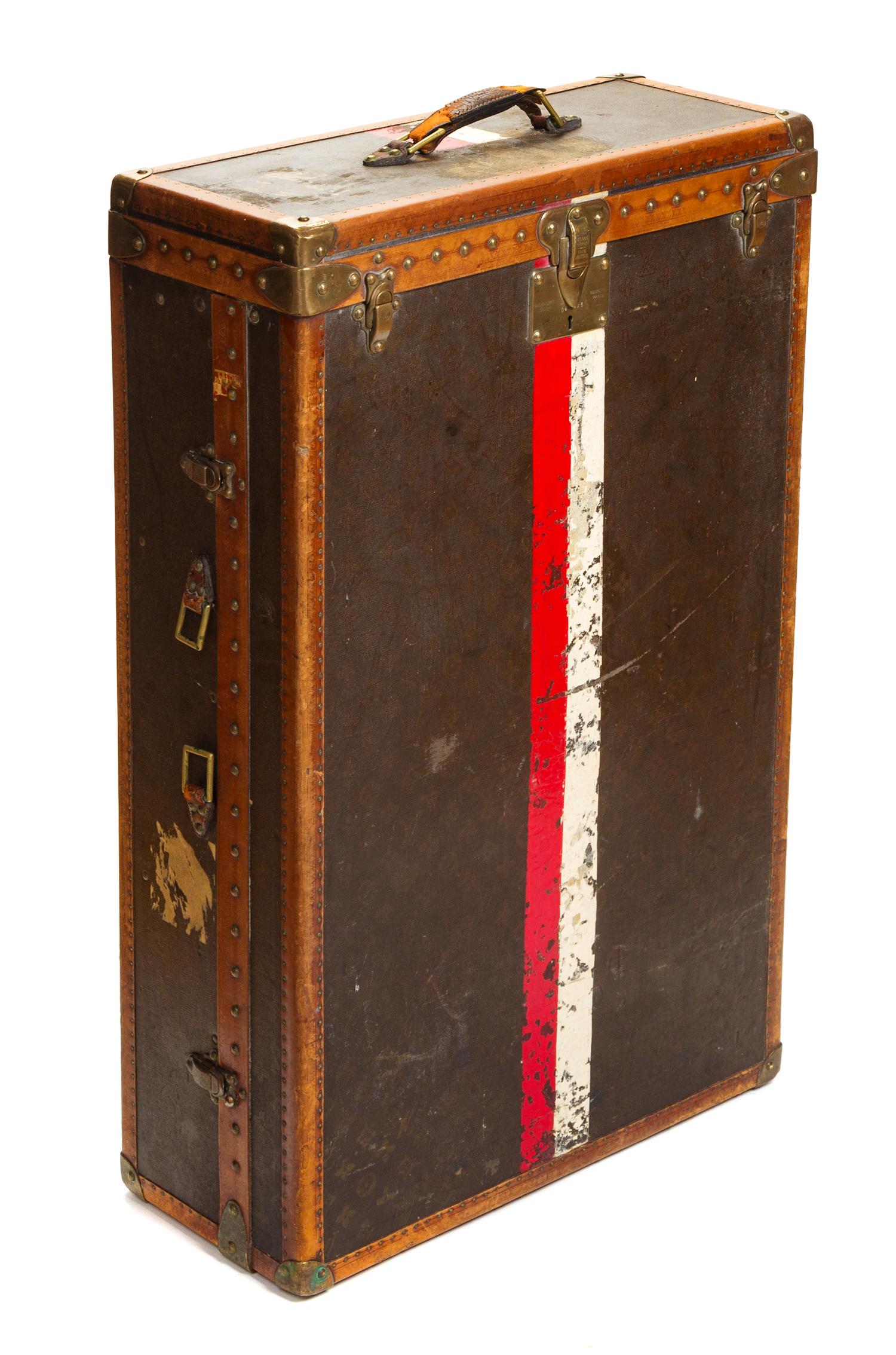 A Louis Vuitton Monogram Leather Wardrobe Trunk, 33.5"H x 21.25"W x 9"D.
