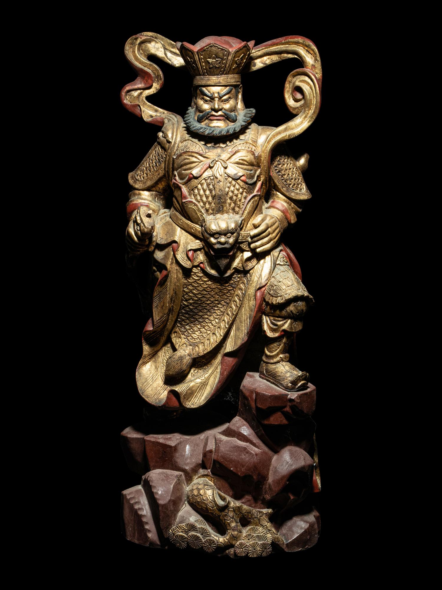 A Set of Four Gilt and Red Lacquered Wood Figures of Guardians