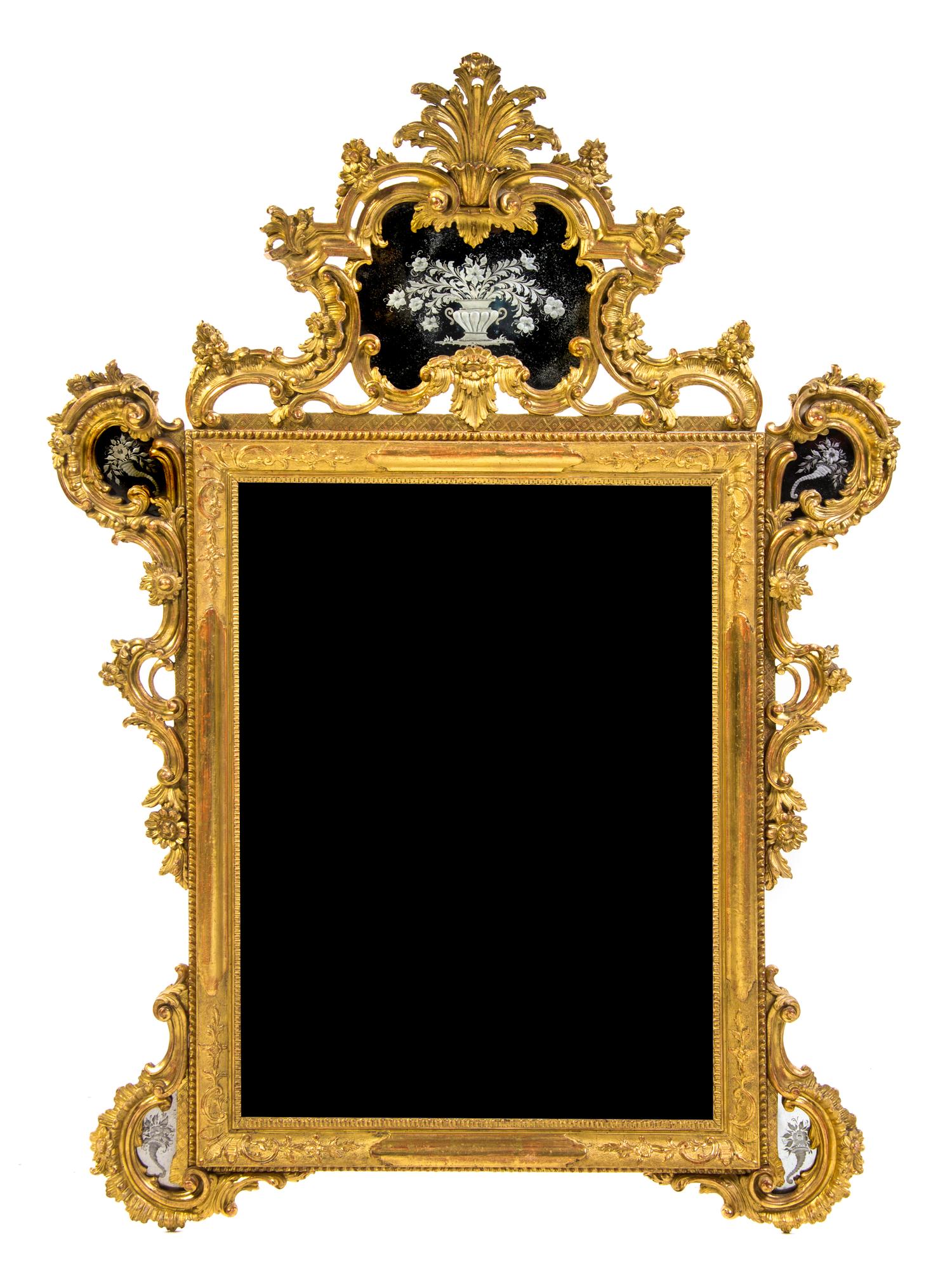 An Italian Giltwood Mirror, Height 57 x width 39 inches.