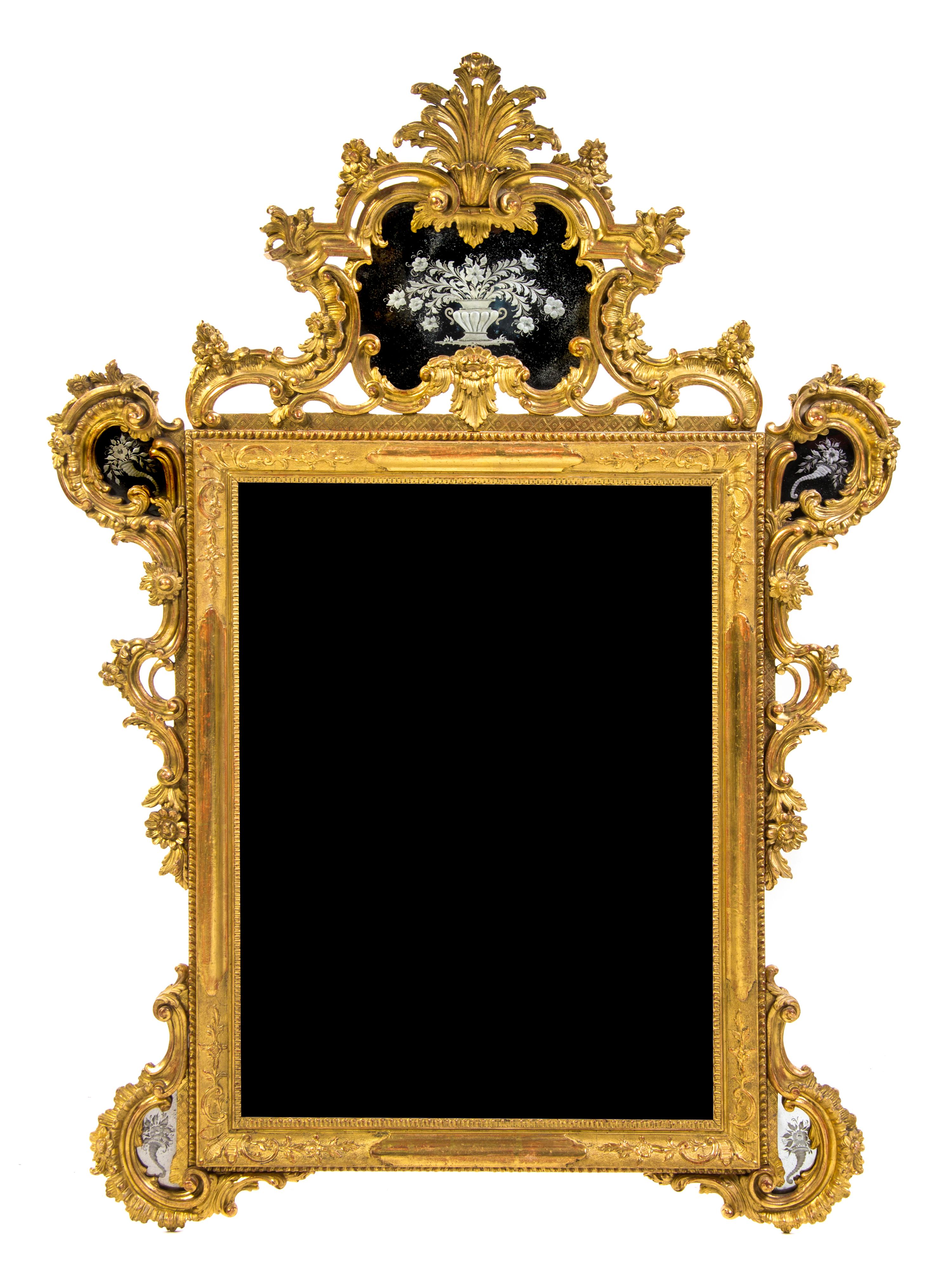 An Italian Giltwood Mirror, Height 57 x width 39 inches.