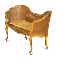 A Louis XV Style Caned Giltwood Settee