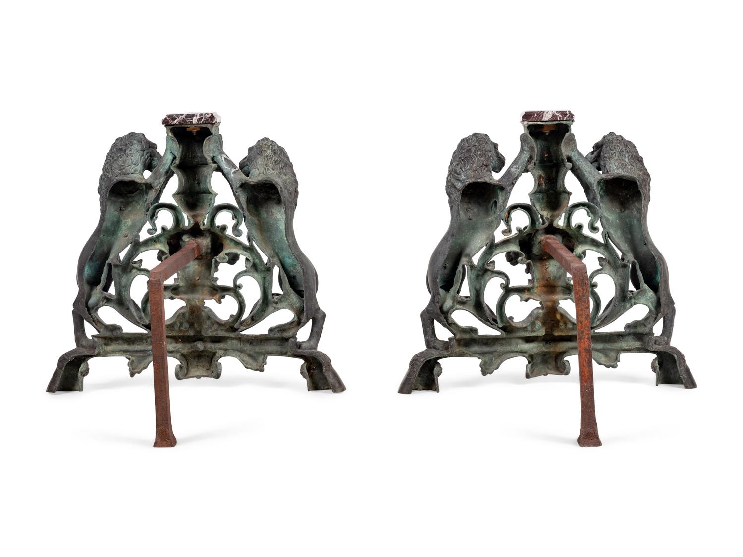 A Pair of Continental Cast Metal Andirons