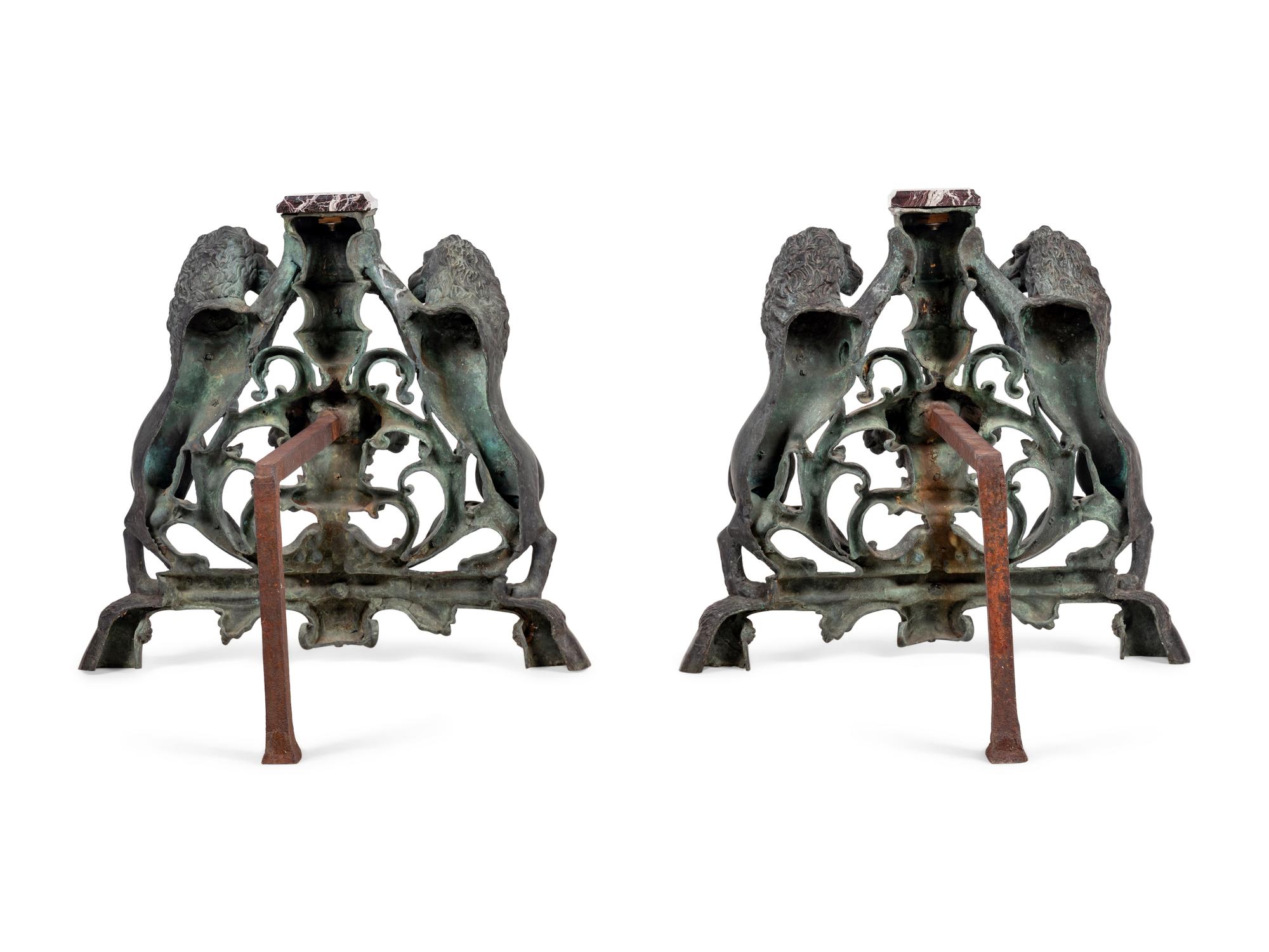 A Pair of Continental Cast Metal Andirons