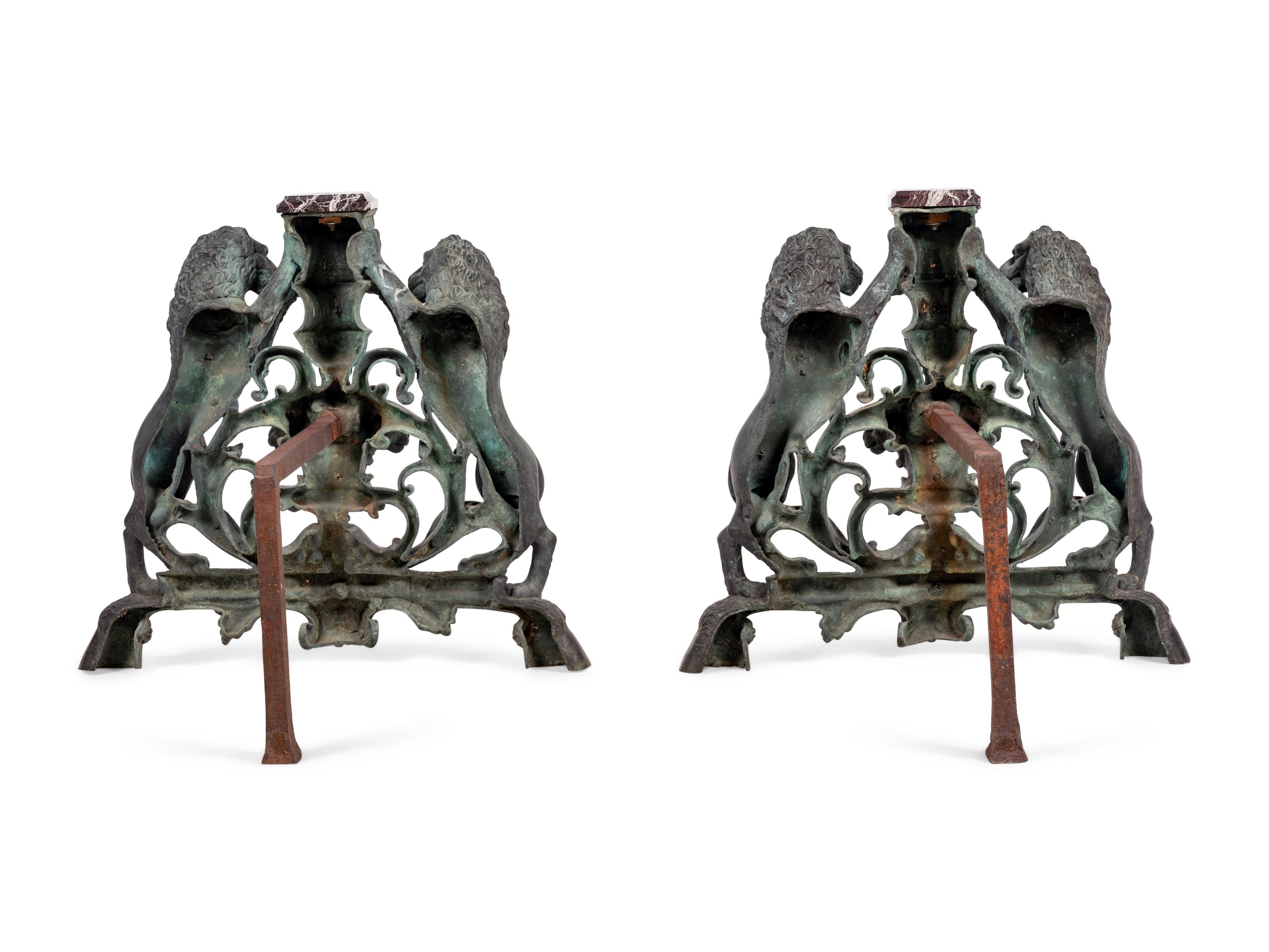 A Pair of Continental Cast Metal Andirons