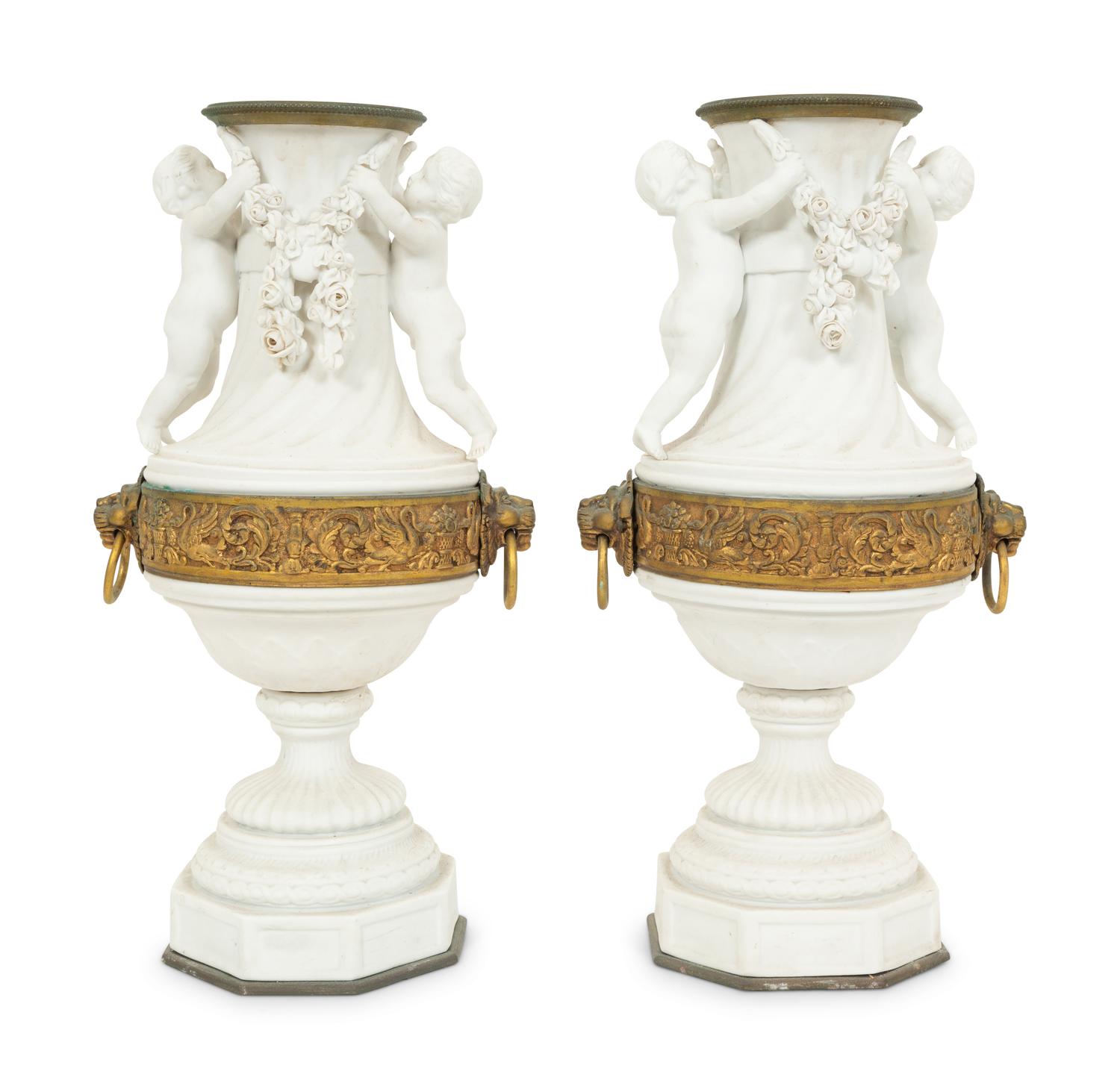 A Pair of Gilt Metal Mounted Bisque Porcelain Urns