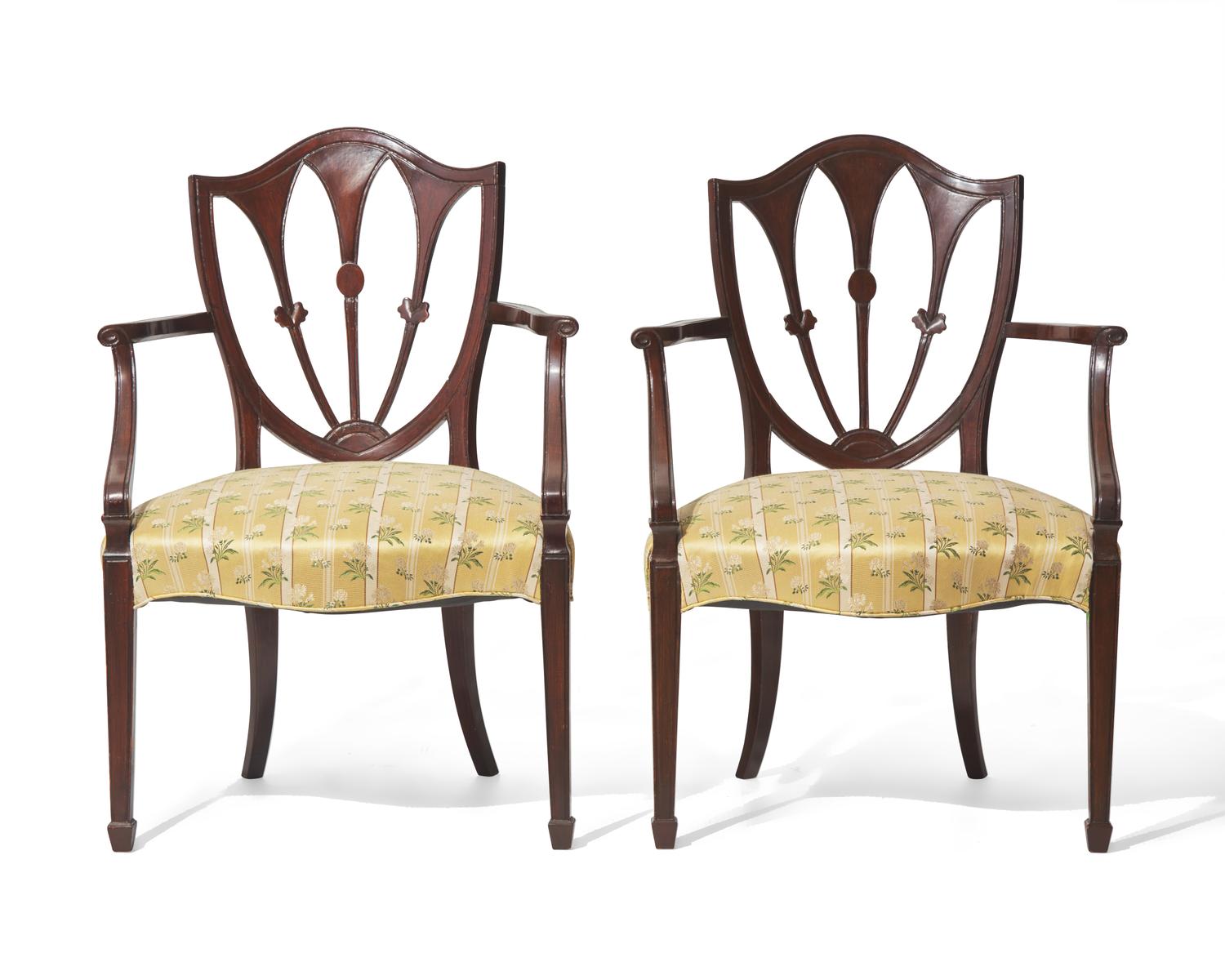 A pair of George III shield-back mahogany armchairs, late 18th / 19th century